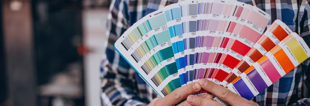 man-working-printing-house-with-paper-paints